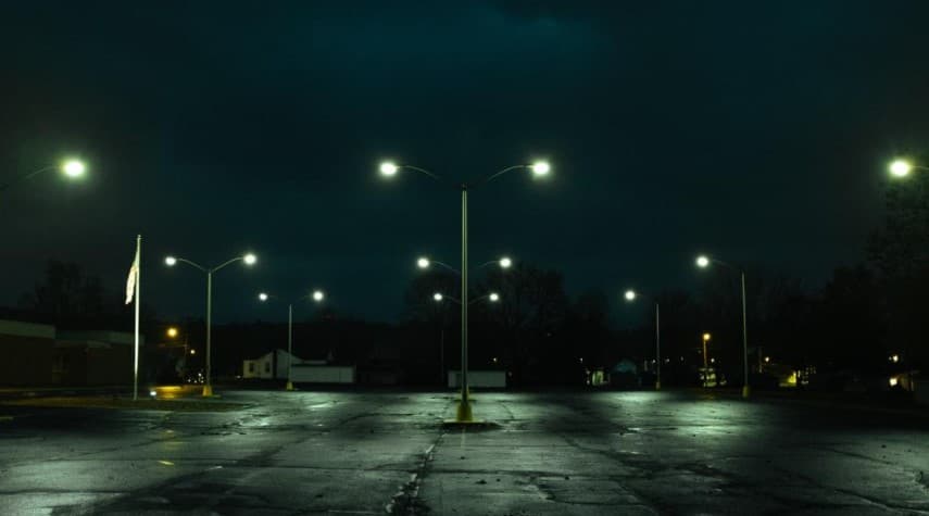 Illuminated commercial parking lot lights at night