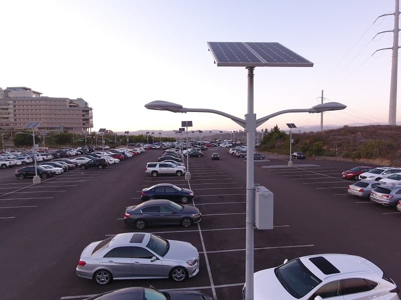 Aerial view of a parking lot lit by LED light fixtures at dusk
