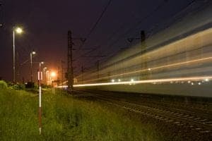 Solar trail light installed beside a rail-with-trail path