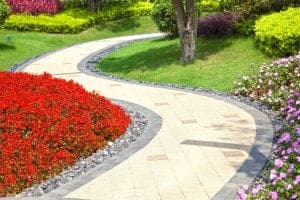 Solar pathway lighting along a landscaped walkway