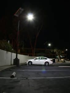 Commercial solar parking lot light illuminated at night