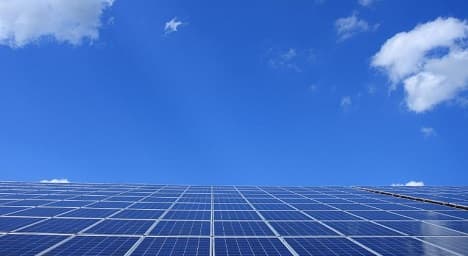 High-output solar light fixture mounted on a commercial pole