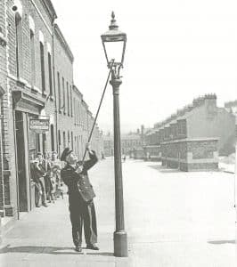Illustration of a vintage lamplighter representing the history of street lighting