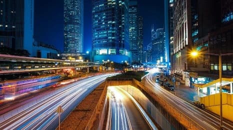 Bright solar street light illuminating a roadway at night