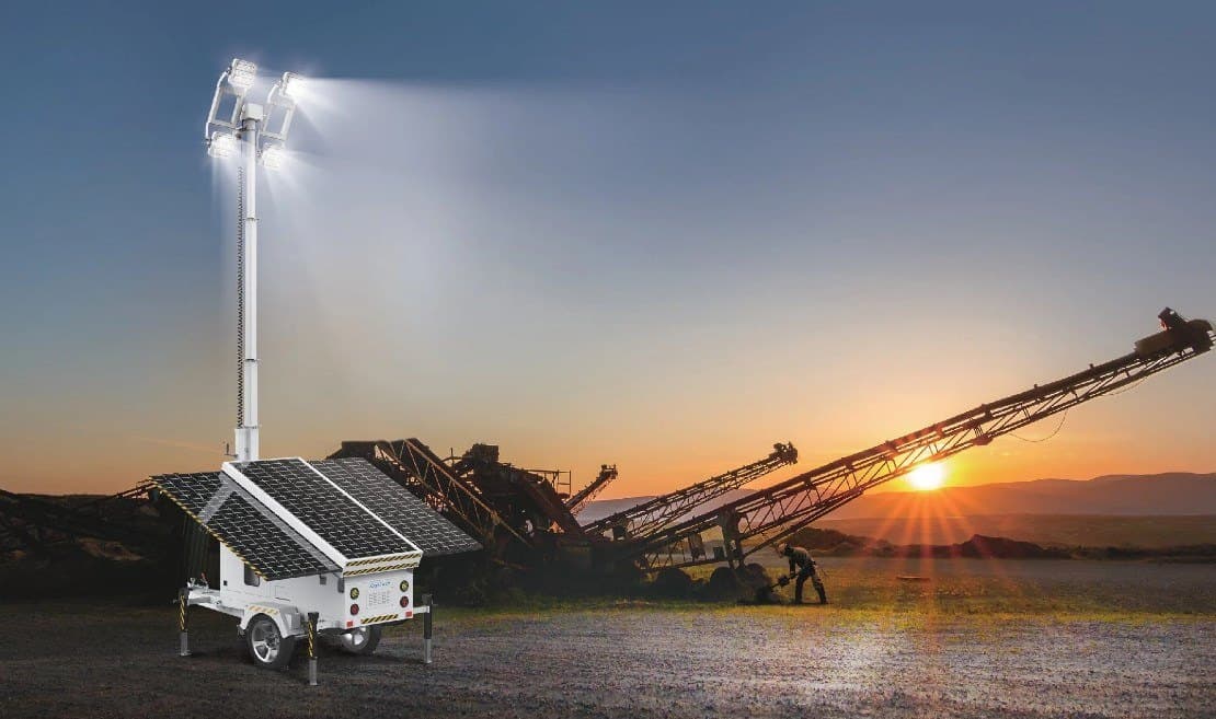 Hybrid mobile solar light tower providing illumination at a nighttime work site