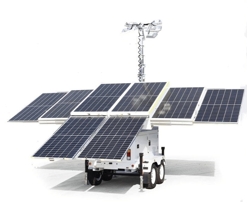 Mobile solar light tower deployed next to traditional diesel lighting equipment